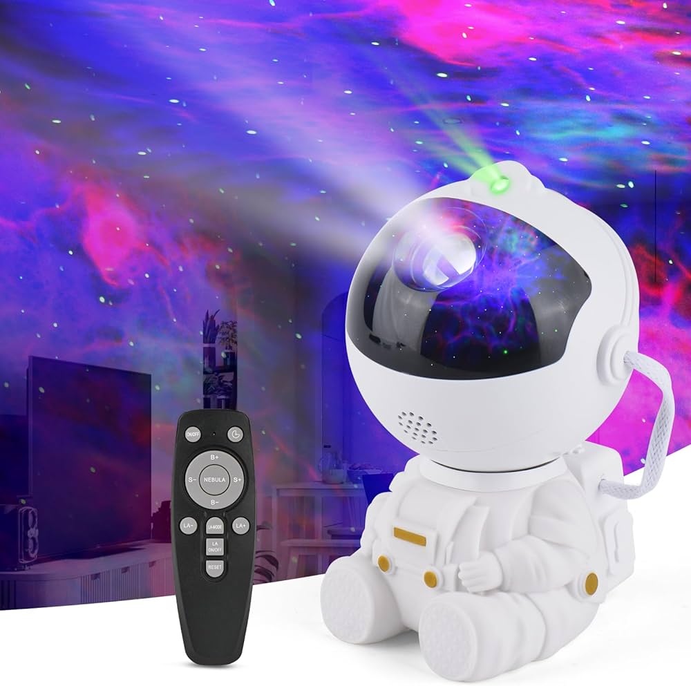 White seated astronaut star projector with black remote control and colourful nebula illustration